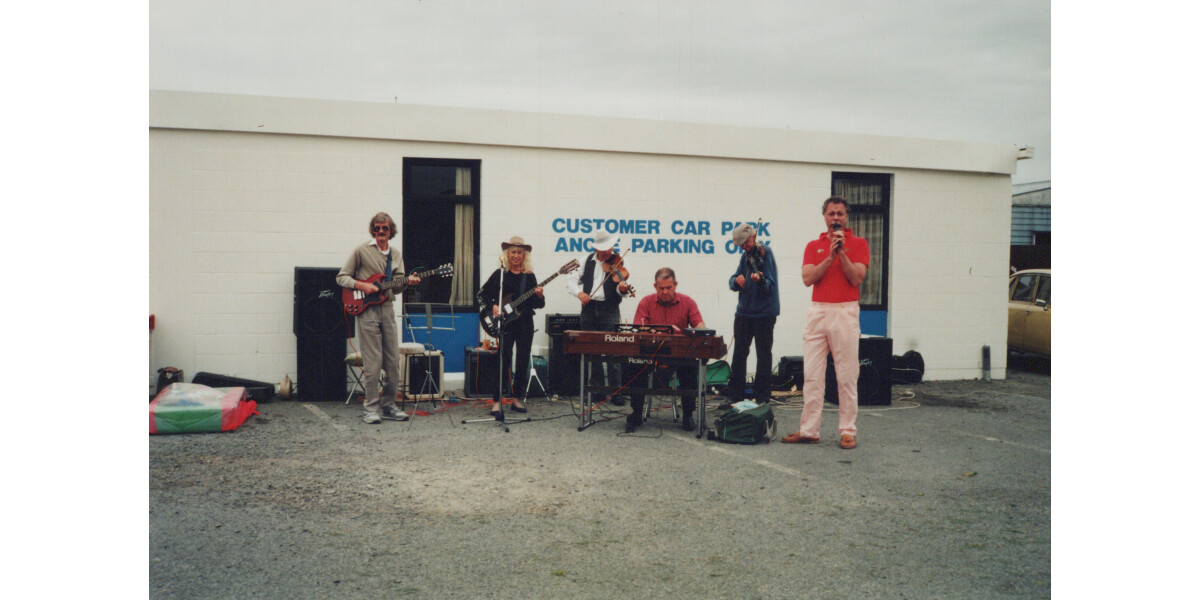 Members of the “Turkey Buzzard” band performing in an...