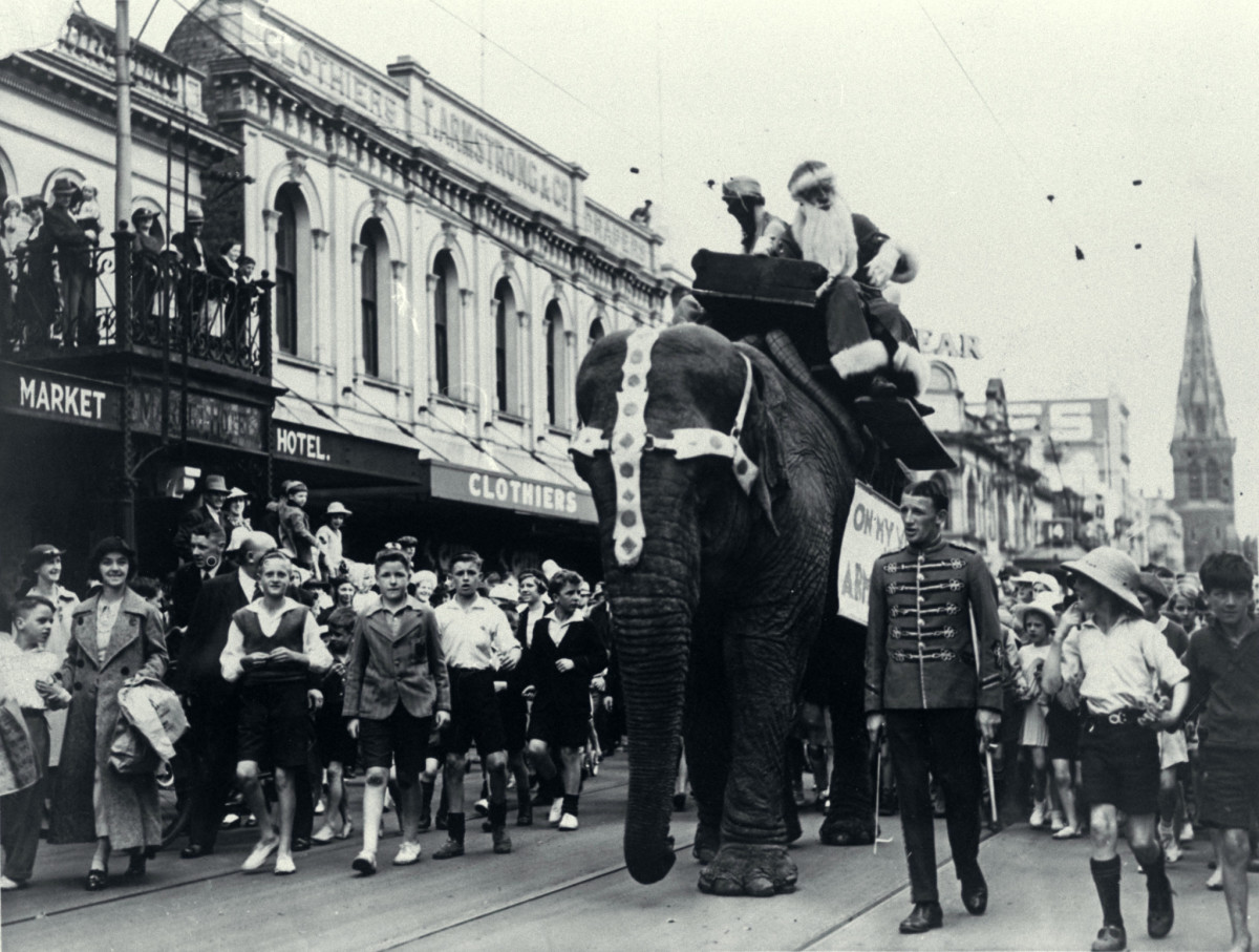 A Christmas parade passes along Colombo Street, Christchurch