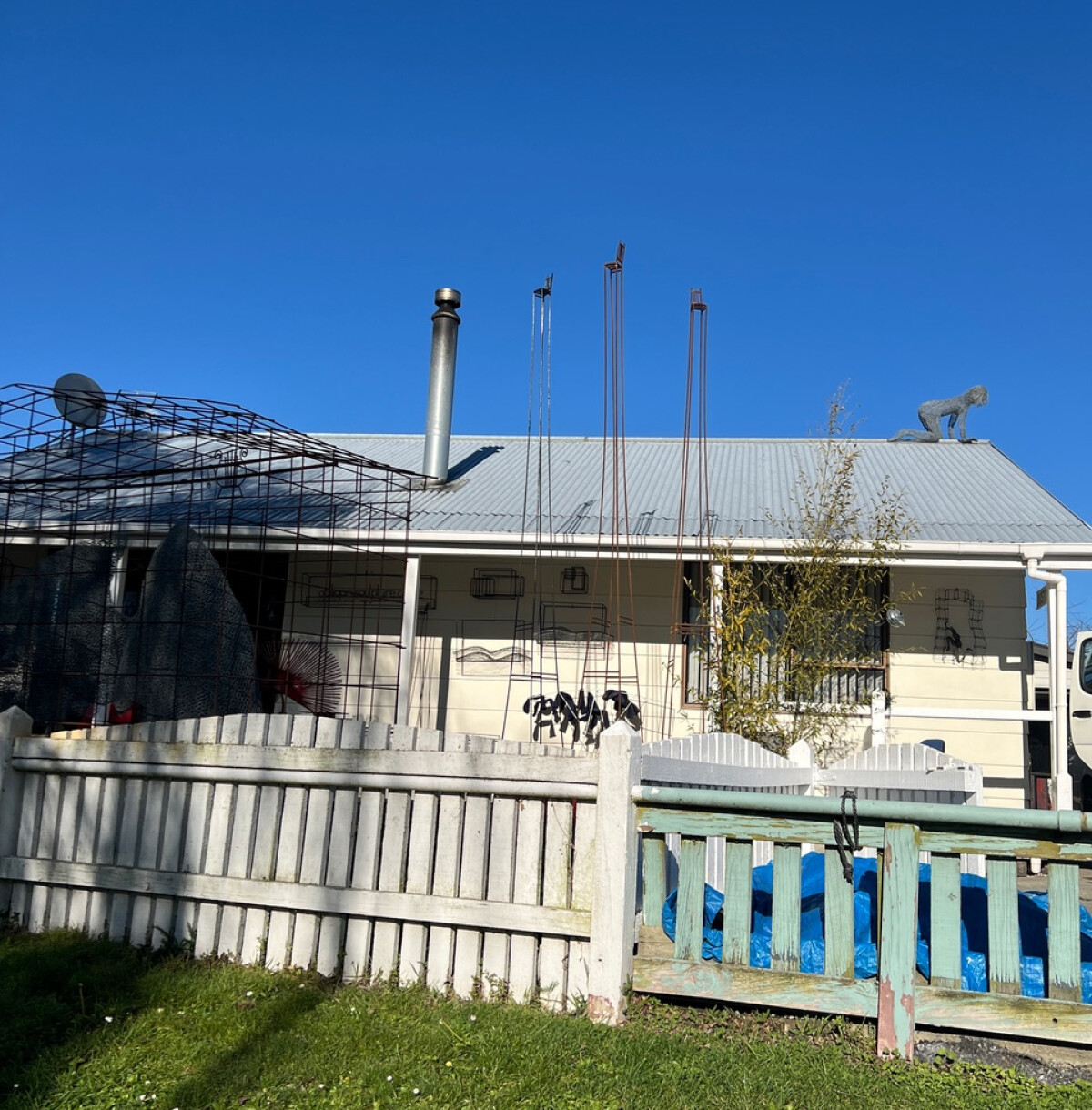 House with metal sculptures