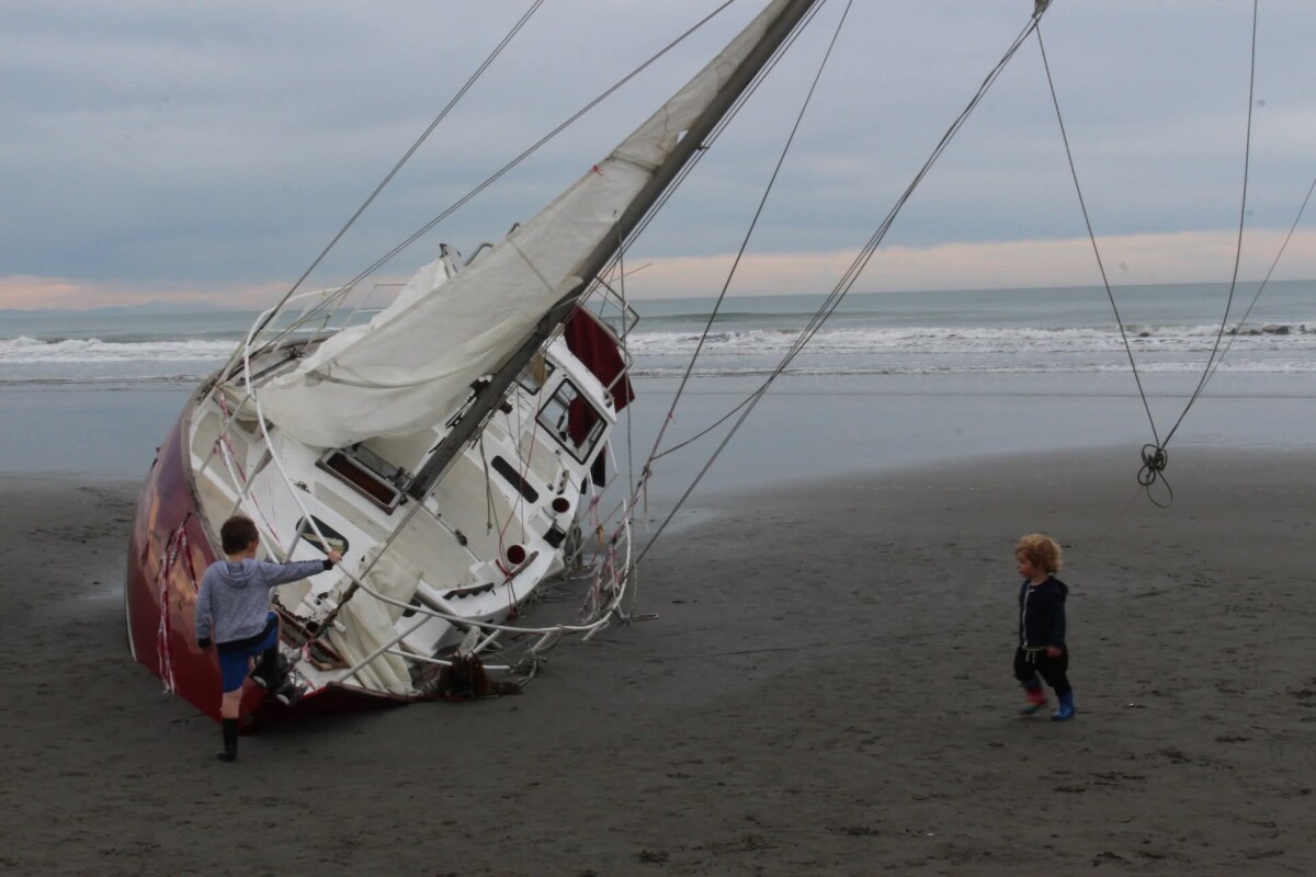 Stricken yacht washed up on New Brighton Beach