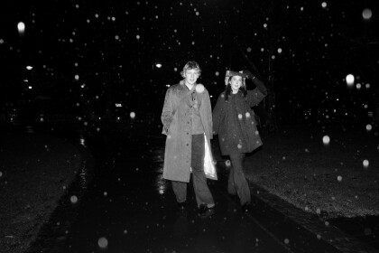 Pair stroll through the rain