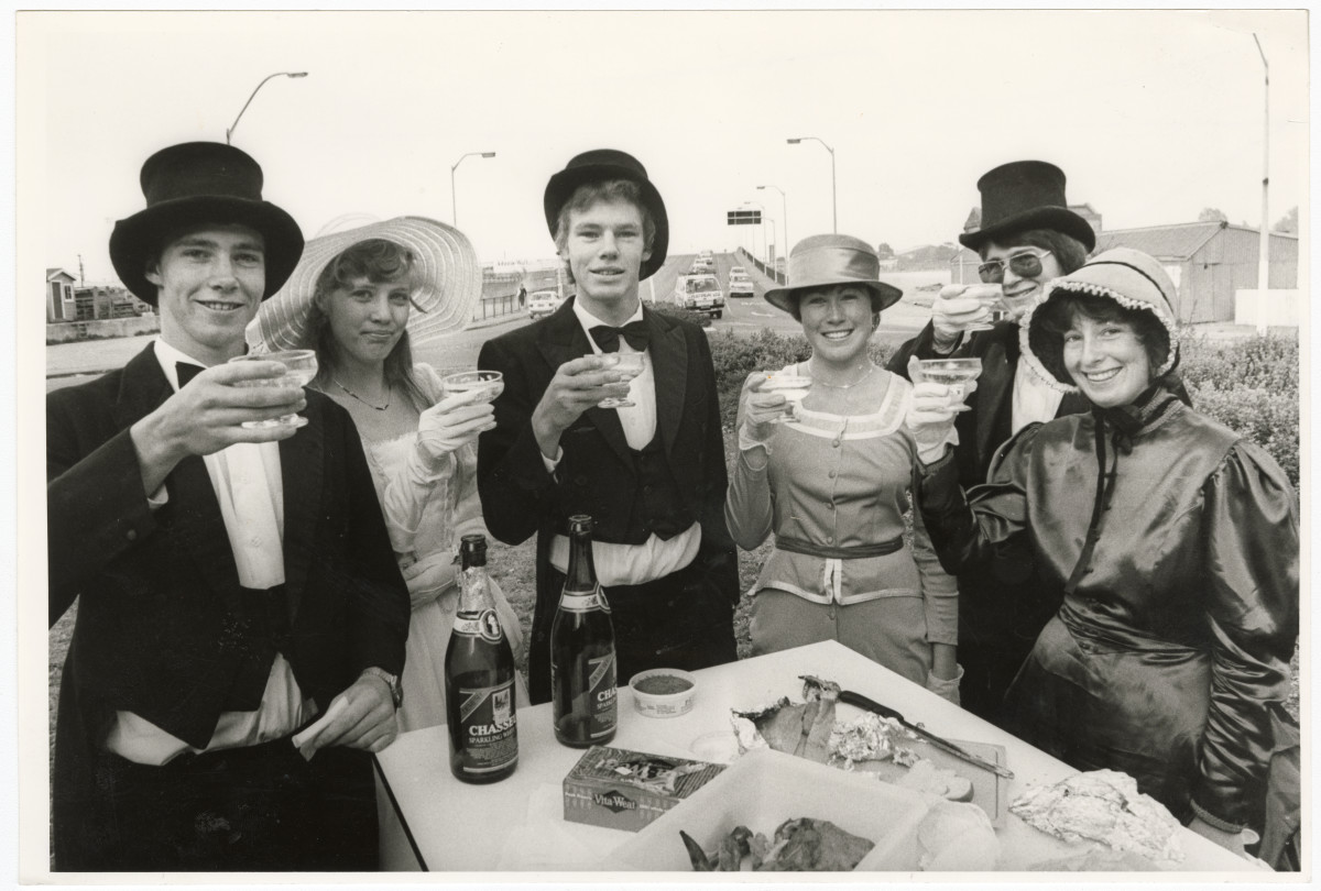 Black and white photo showing University students champagne breakfast on roundabout. 1983