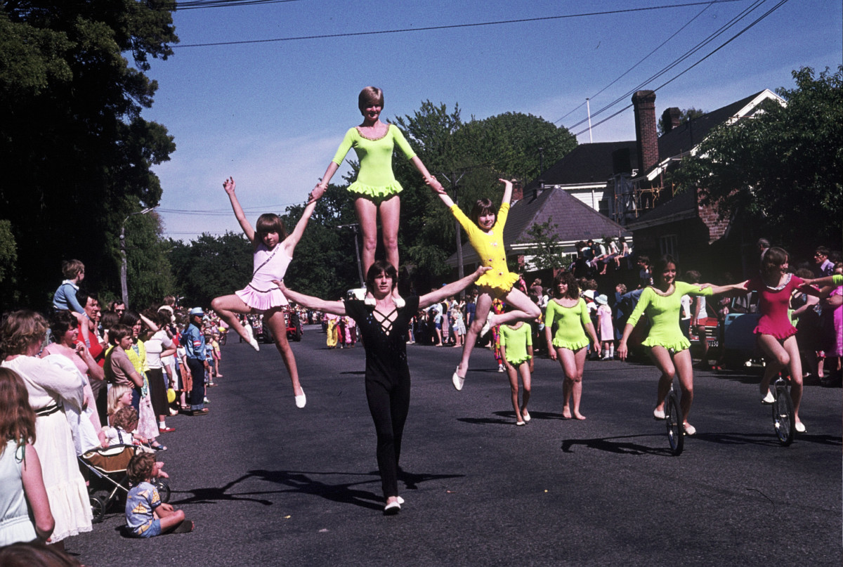 Photo of acrobats performing tricks in a parade