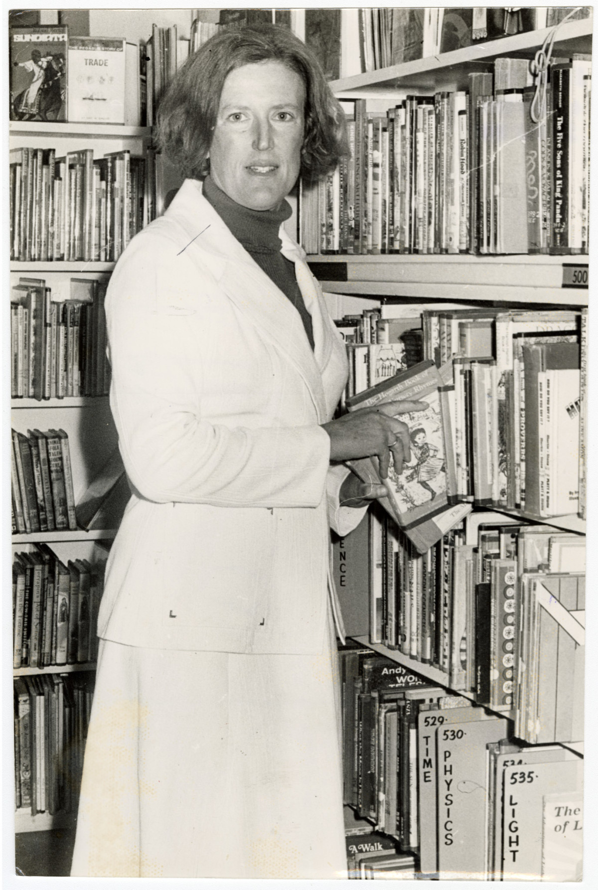 Margaret Mahy in a library. 2 December 1975. © Christchurch Star. CCL-StarP-00710A