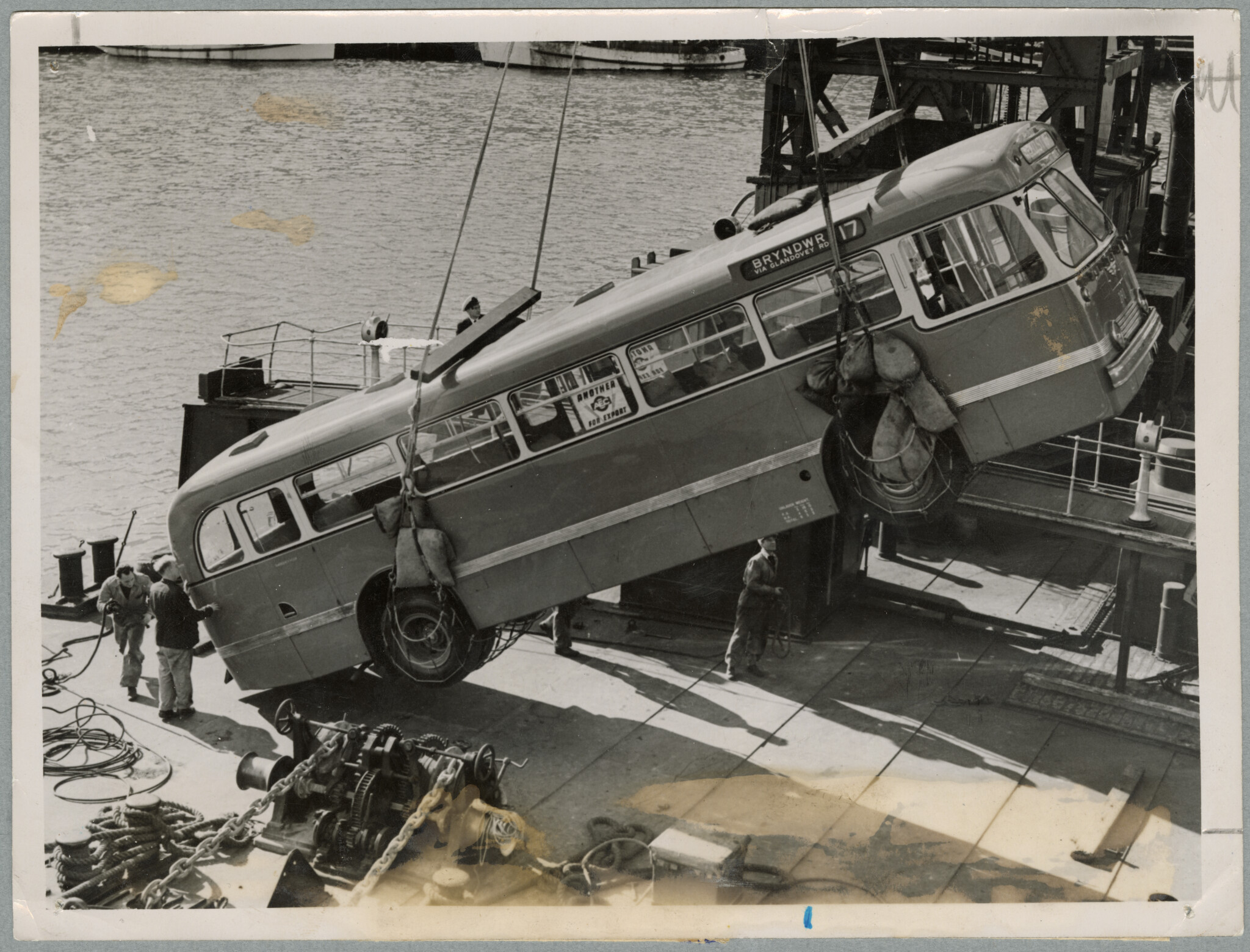 Unloading the new diesel bus. 2 August 1954. Christchurch Star archive. In copyright. CCL-StarP-04189A.